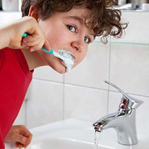 Boy brushing his teeth