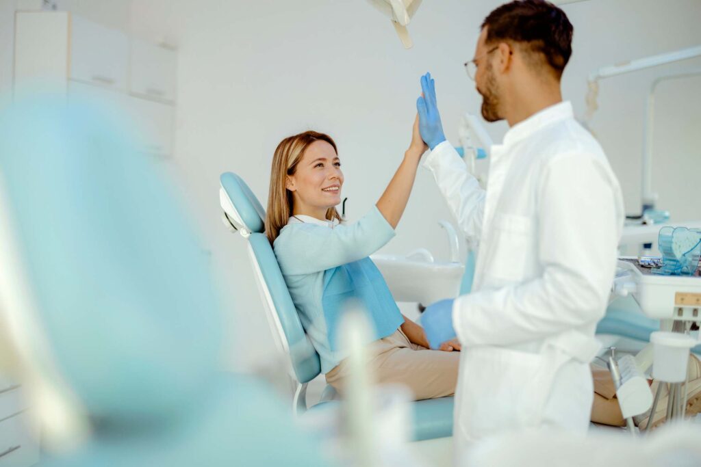 Dentist and patient celebrating successful preventive dental care in Highland, IN