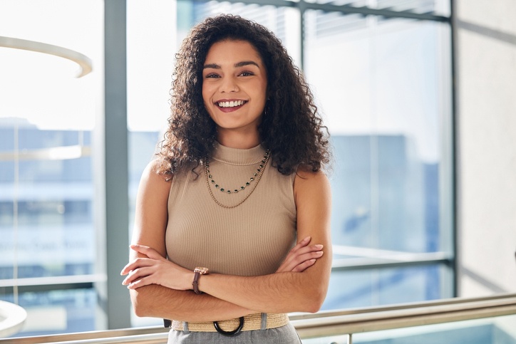 Confident professional smiling after cosmetic dental treatment at Elite Dental of Highland.